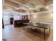 Finished basement with a bar, tile flooring, and a ping pong table; perfect for entertaining at 200 Long Needle Ct, Sugar Hill, GA 30518