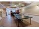Finished basement with a bar, tile flooring, and ping pong table, perfect for hosting guests at 200 Long Needle Ct, Sugar Hill, GA 30518