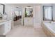 Open bathroom view features tiled floors, soaking tub and dual sink vanity areas at 200 Long Needle Ct, Sugar Hill, GA 30518