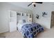 Bedroom with carpeted floors features a built-in shelving unit at 200 Long Needle Ct, Sugar Hill, GA 30518