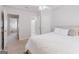 Bedroom featuring neutral paint tones, a ceiling fan, and access to the bathroom at 200 Long Needle Ct, Sugar Hill, GA 30518