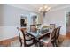 Dining room boasts ample seating and an elegant view of the living spaces at 200 Long Needle Ct, Sugar Hill, GA 30518
