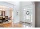 Bright foyer with hardwood floors, and elegant trimwork leading to the dining room at 200 Long Needle Ct, Sugar Hill, GA 30518