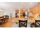 Open kitchen with granite countertops, stainless steel appliances, and hardwood floors at 200 Long Needle Ct, Sugar Hill, GA 30518
