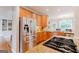 Modern kitchen featuring granite countertops, stainless steel appliances and beautiful cabinetry at 200 Long Needle Ct, Sugar Hill, GA 30518