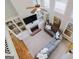Spacious living room with high ceilings, built-in shelving, and a fireplace at 200 Long Needle Ct, Sugar Hill, GA 30518