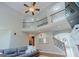Elegant living room with staircase, high ceilings, and decorative railings at 200 Long Needle Ct, Sugar Hill, GA 30518