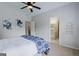 Bright main bedroom features vaulted ceiling, ceiling fan, ensuite bathroom and modern decor at 200 Long Needle Ct, Sugar Hill, GA 30518