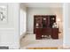 Home office features a large desk and bookcase, providing a functional and stylish workspace at 200 Long Needle Ct, Sugar Hill, GA 30518