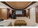 Cozy home theater in the basement with custom cabinets and comfortable seating; perfect for relaxation at 200 Long Needle Ct, Sugar Hill, GA 30518