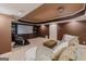 Finished basement with home theater, custom cabinets, and comfy seating; an inviting space at 200 Long Needle Ct, Sugar Hill, GA 30518