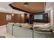 Home theater boasts a projector, screen, custom cabinets, and comfortable seating for movie nights at 200 Long Needle Ct, Sugar Hill, GA 30518