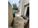 The backyard patio area features a shed, chairs, and a view of the wooden fence and partial house exterior at 2009 Oak Park Ln, Decatur, GA 30032