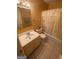 Bathroom featuring a combination tub and shower with curtain, standard toilet, and a vanity with sink at 2009 Oak Park Ln, Decatur, GA 30032