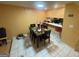 Bright dining area with tiled floor, an adjacent snack bar, and modern pendant lighting at 2009 Oak Park Ln, Decatur, GA 30032