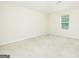 Spacious, carpeted bedroom with neutral walls, vaulted ceiling, and a window with blinds at 232 Shelton Cir, Temple, GA 30179
