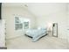 Comfortable bedroom with a cozy bed, vaulted ceiling and lots of light from large window at 232 Shelton Cir, Temple, GA 30179