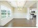 Bright, open dining room with coffered ceilings, hardwood floors and view to the kitchen at 232 Shelton Cir, Temple, GA 30179