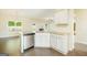 Kitchen with stainless steel dishwasher, granite countertops, and white cabinetry at 232 Shelton Cir, Temple, GA 30179