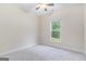 Cozy bedroom featuring neutral carpet, a window offering natural light, and ample space at 129 Academy Ln, Canton, GA 30114
