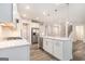 Bright kitchen featuring a center island with bar seating and stainless steel appliances at 129 Academy Ln, Canton, GA 30114