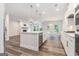 Spacious kitchen with large island, stainless steel appliances, and open layout to the living area at 129 Academy Ln, Canton, GA 30114
