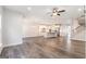 Open-concept living space featuring hardwood floors and an eat-in kitchen with stainless steel appliances at 129 Academy Ln, Canton, GA 30114