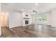 Living area with a fireplace, hardwood floors, and a view of the deck and backyard at 129 Academy Ln, Canton, GA 30114