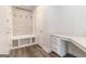 Mud room with storage lockers, built-in bench, and a desk area for organization at 129 Academy Ln, Canton, GA 30114