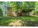 Backyard featuring a walkout basement, deck, and mossy green yard at 5341 Terrytown Ln, Lithonia, GA 30038