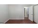 Bedroom featuring wood flooring, neutral paint, and a closet for ample storage at 5341 Terrytown Ln, Lithonia, GA 30038