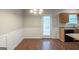 Cozy dining area adjacent to kitchen with a round table and stylish wainscoting, with access to the outdoors at 5341 Terrytown Ln, Lithonia, GA 30038