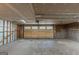 Unfinished garage featuring large garage door and natural light at 5341 Terrytown Ln, Lithonia, GA 30038