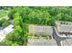 Aerial view of townhomes surrounded by lush green trees at 711 Topsail Ln, Alpharetta, GA 30005