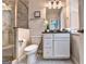 Well-appointed bathroom with tiled shower, toilet, and vanity with granite countertop at 711 Topsail Ln, Alpharetta, GA 30005