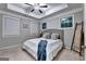 Comfortable bedroom features a tray ceiling, plush carpet, and natural light from multiple windows at 711 Topsail Ln, Alpharetta, GA 30005