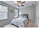 Bedroom filled with natural light, complemented by a ceiling fan at 711 Topsail Ln, Alpharetta, GA 30005