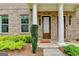 Front entrance of the townhome with a festive 