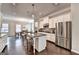 Kitchen featuring stainless steel appliances, granite countertops, and an island with bar seating at 711 Topsail Ln, Alpharetta, GA 30005
