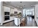 Open kitchen with an island, stainless steel appliances, and granite countertops at 711 Topsail Ln, Alpharetta, GA 30005