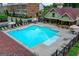 Community pool with lounge chairs and covered seating area at 711 Topsail Ln, Alpharetta, GA 30005