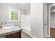 A full bathroom features a tub, shower, granite vanity and tiled floors at 2487 Highland Se Dr, Conyers, GA 30013