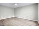 Empty bedroom shows hardwood floors and neutral walls, ready for personal touches at 2487 Highland Se Dr, Conyers, GA 30013
