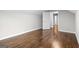 This vacant bedroom has hardwood floors and an open closet at 2487 Highland Se Dr, Conyers, GA 30013