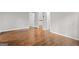 This vacant bedroom has hardwood floors and white walls at 2487 Highland Se Dr, Conyers, GA 30013