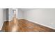 An empty bedroom features hardwood floors and white painted walls at 2487 Highland Se Dr, Conyers, GA 30013