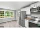 Updated kitchen featuring stainless steel appliances and a bright eating nook at 2487 Highland Se Dr, Conyers, GA 30013