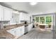 Bright kitchen with granite countertops, stainless appliances, and an eat-in area at 2487 Highland Se Dr, Conyers, GA 30013