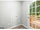 The laundry room features access to a new back deck and new flooring at 2487 Highland Se Dr, Conyers, GA 30013