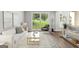 Bright living room with neutral walls, light wood floors and a large window with a view to the yard at 2487 Highland Se Dr, Conyers, GA 30013